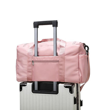 Large-capacity water-repellent travel bag on suitcase, pink, nylon, 20-35L.