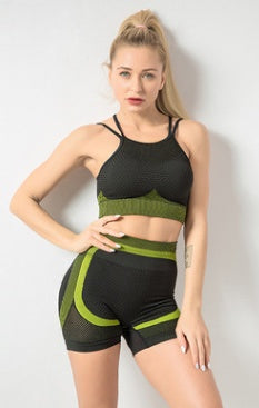 Two-piece yoga set for women in black and green, sporty gym clothing.