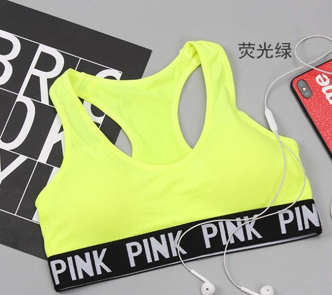 Neon yellow Training Pro Women Sports Bra with &quot;PINK&quot; strap detail.