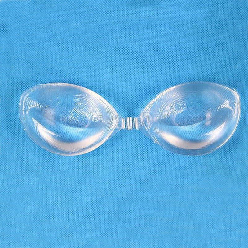 Transparent silicone gather thickened invisible bra on blue background.