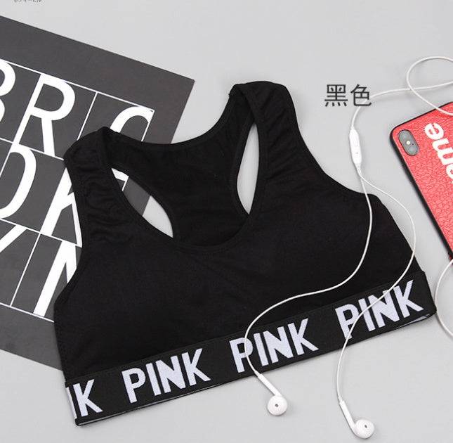 Training Pro Women Sports Bra in black with supportive band and stylish design.