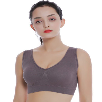 Plus size seamless bra with pads in gray, modeled by a woman