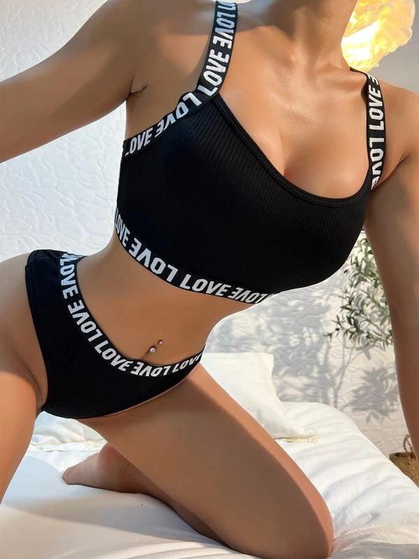 Black mesh knitted push up lingerie set for women, featuring a bra and pants with &quot;LOVE&quot; text on straps, available in sizes S to XL.