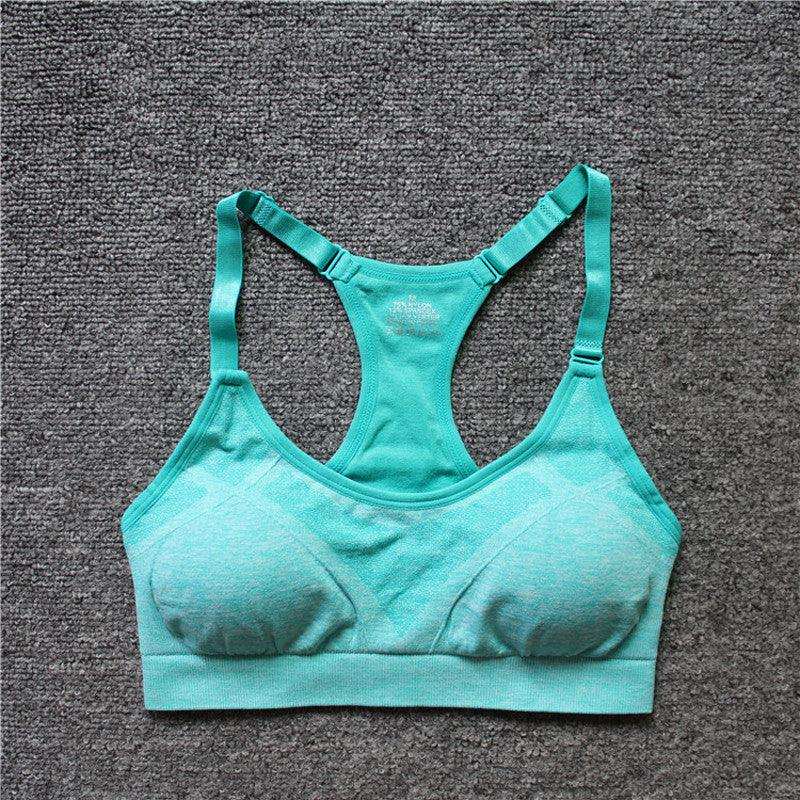 Women Shockproof Sport Bra in turquoise, seamless design for yoga and running.