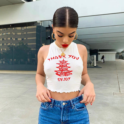 Woman wearing a Yellow Crane Tower vest top with red graphic, round neck, and slim fit style.