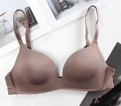 Seamless nylon push-up bra for women in brown with adjustable straps.