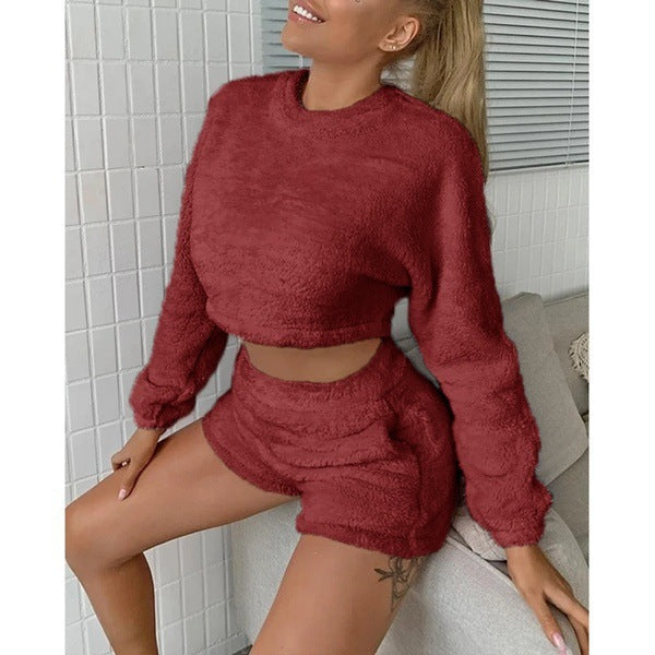 Two-piece red fleece sweater and shorts outfit with round neck and long sleeves.