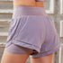 Womens sports shorts with anti-glare fabric and mid-waist design.