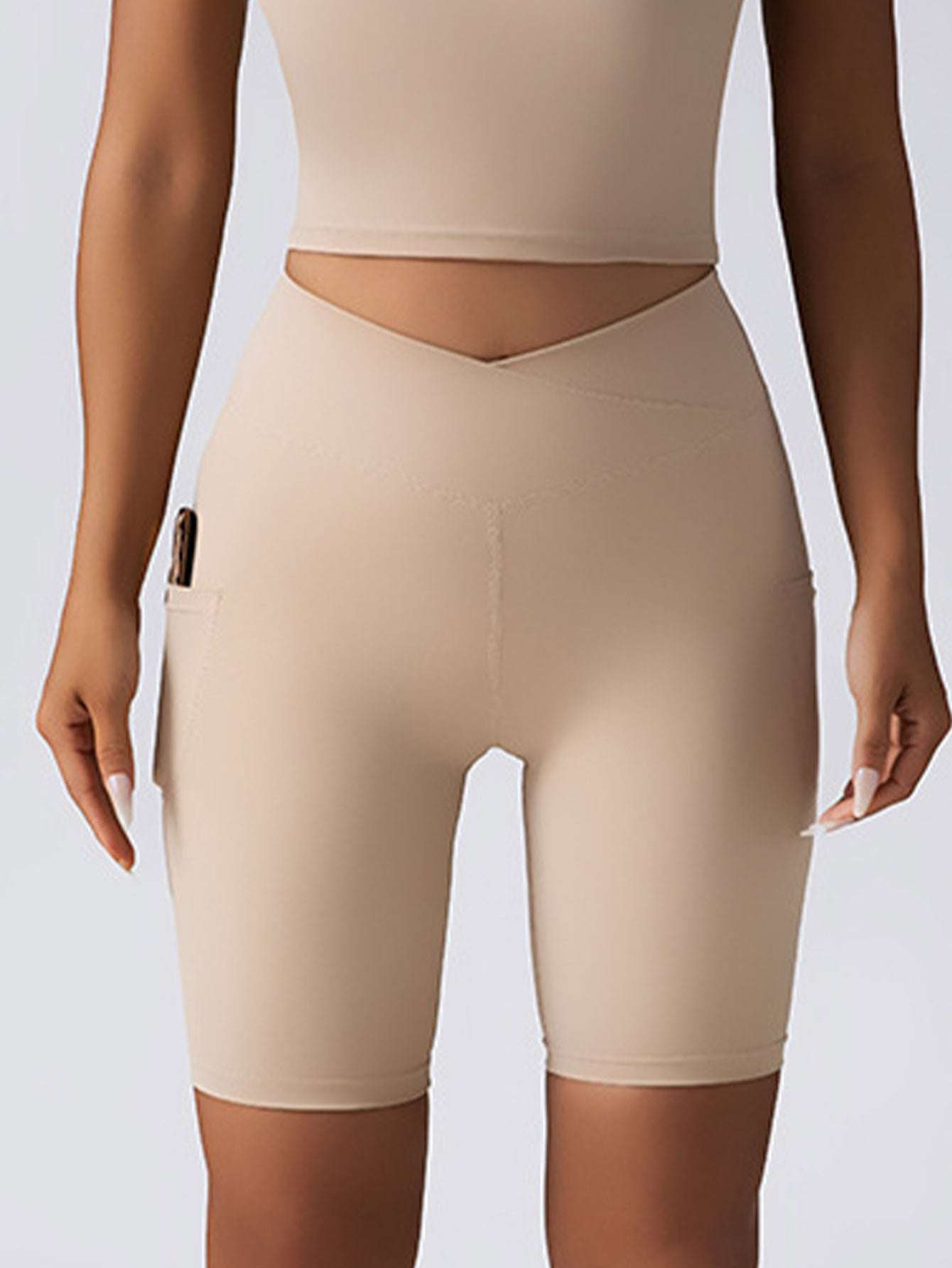 High-waist seamless biker shorts with tummy control and pockets for yoga, gym, or running.