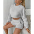 Two-piece round neck long sleeve and shorts set in plain fleece fabric.