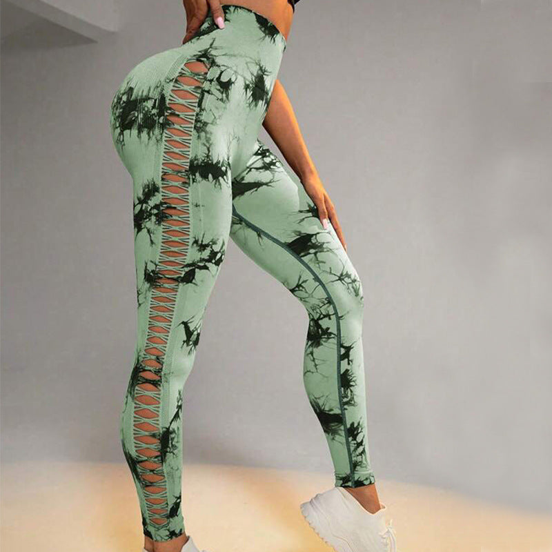 Hollow tie-dye printed yoga pants with high waist and seamless butt lift design for women.