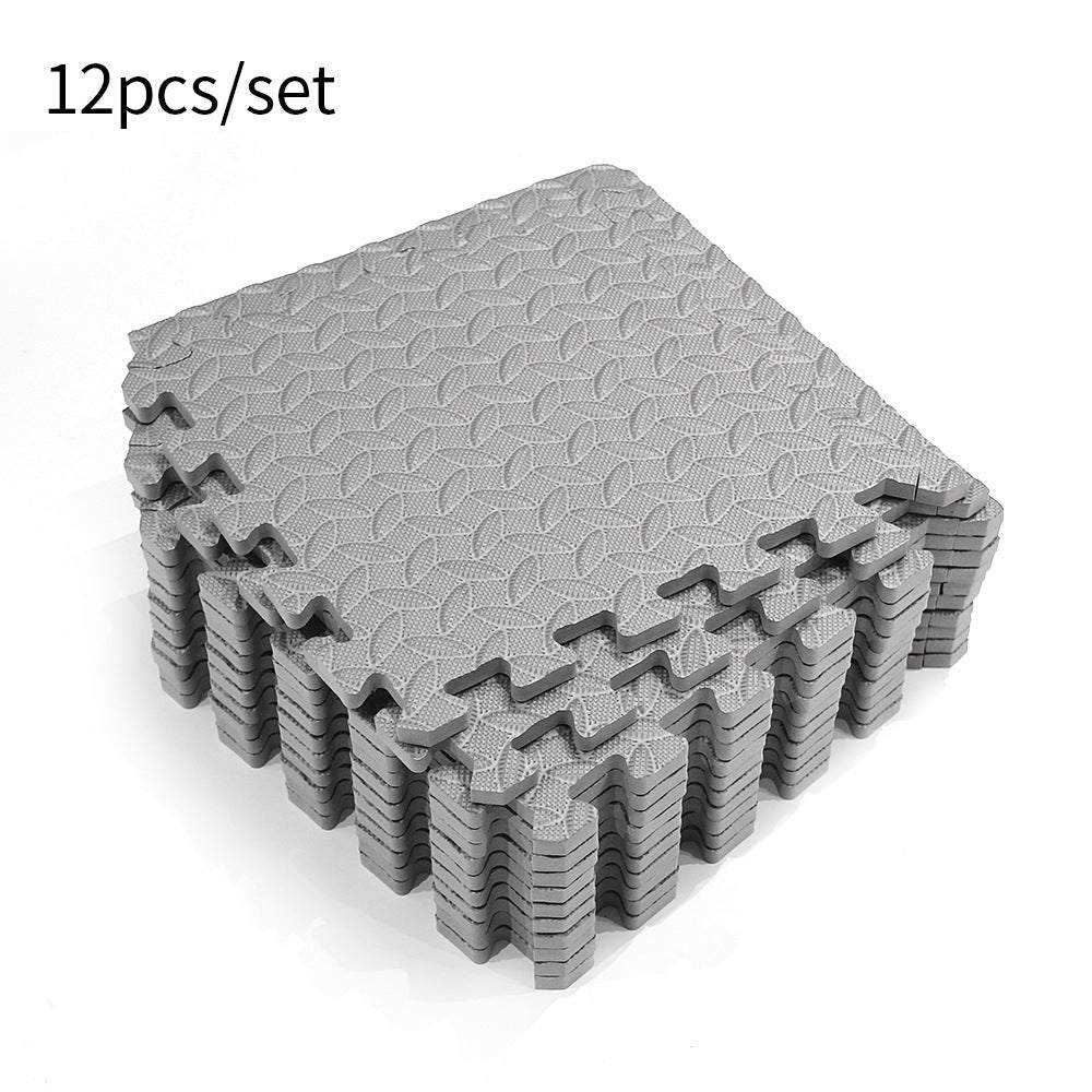 Gray-black EVA foam splicing floor mat set, 12 square pieces for gym cushioning.