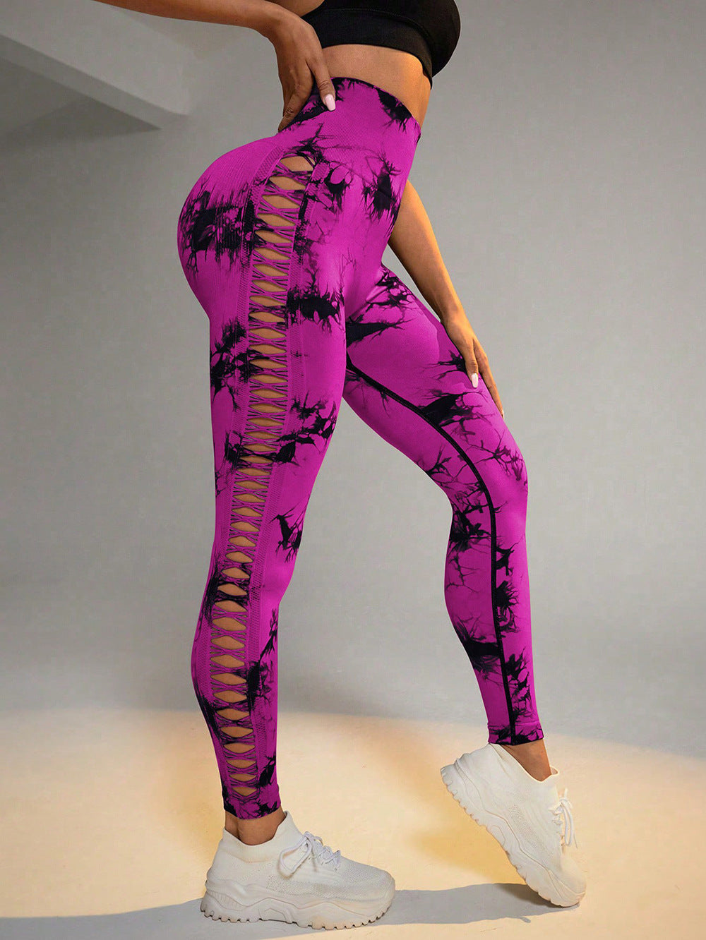 Hollow Tie Dye Printed Yoga Pants in purple with high waist, seamless design, and stylish side cutouts for workout comfort.