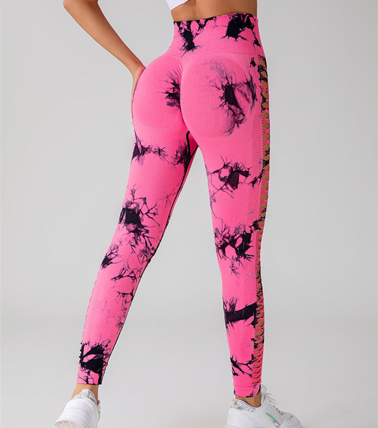 Hollow Tie Dye Printed Yoga Pants in pink with black patterns, high waist, seamless design, showcasing butt lift feature.